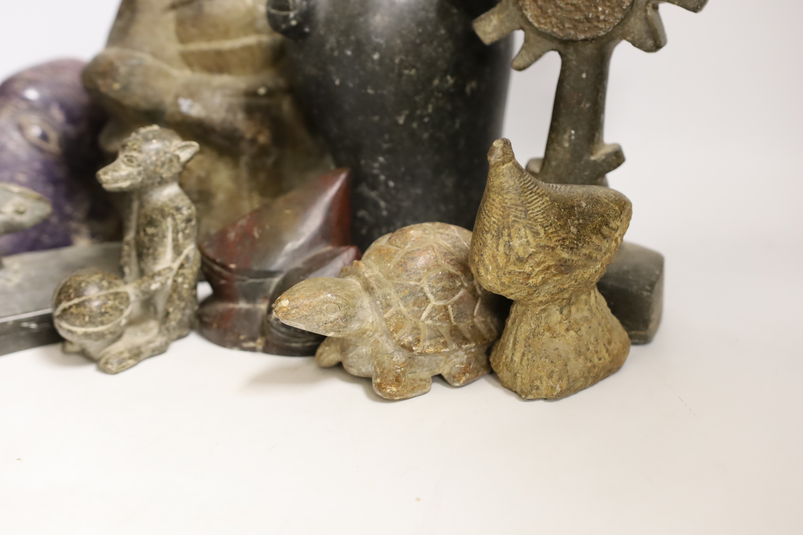 Ten Shona stone carvings, 1960s-70s, including three heads, the first in purple Lepodolite signed Conrad Nyagwande, one signed Amani the other initialled NM, a tortoise, a monkey, a gecko box and abstract sculpture forms